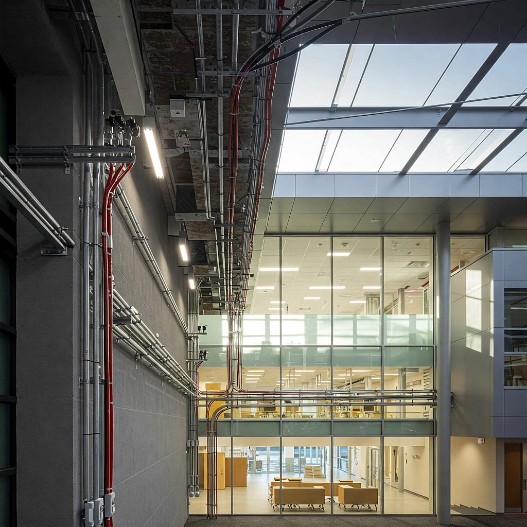 A modern educational building with visible electrical infrastructure]