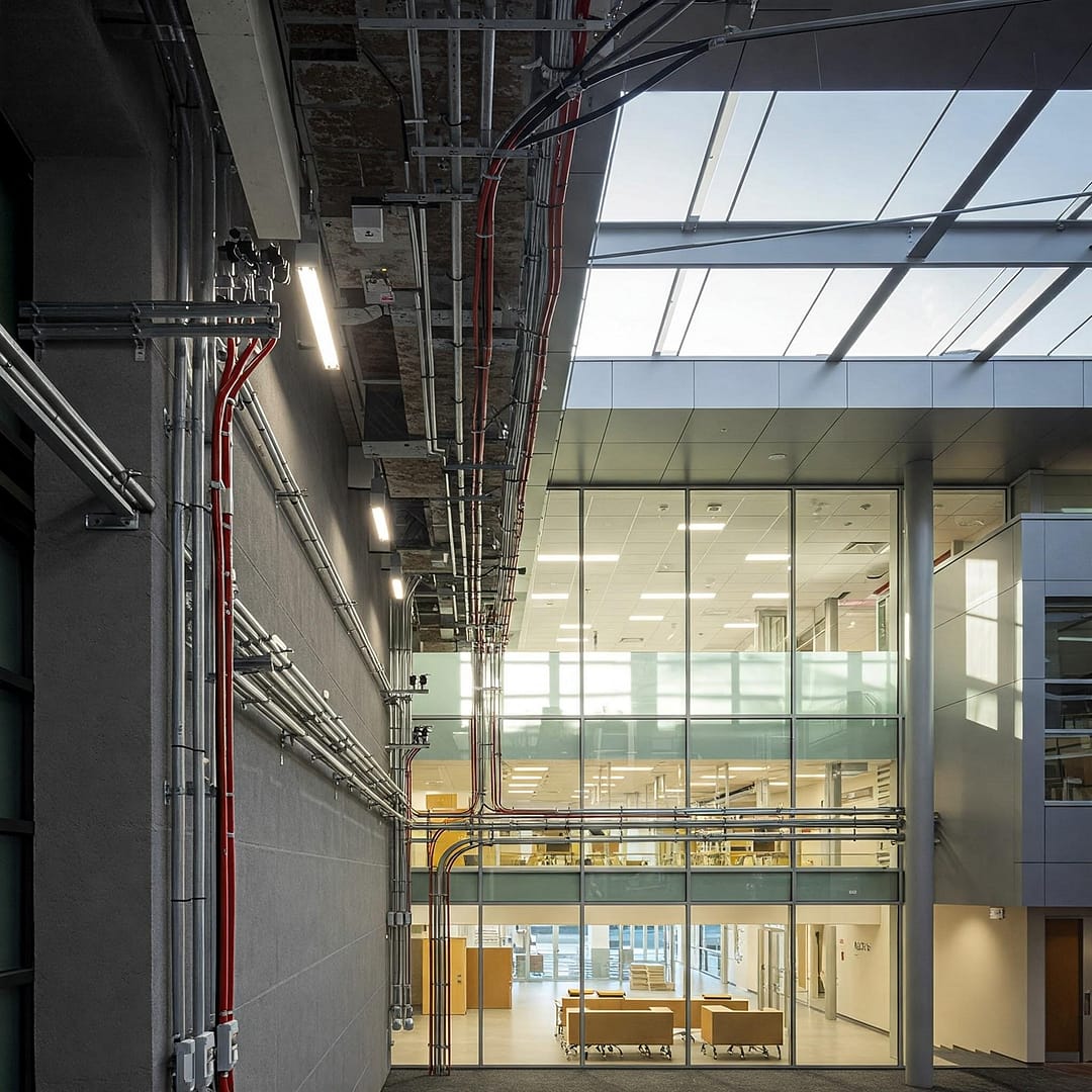 A modern educational building with visible electrical infrastructure]