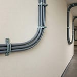An electrical conduit illustrating its suitability for diverse installation requirements.
